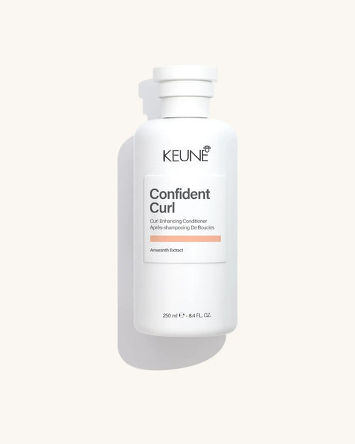 Keune Confident Curl Conditioner product pack shot on Bijou cream background
