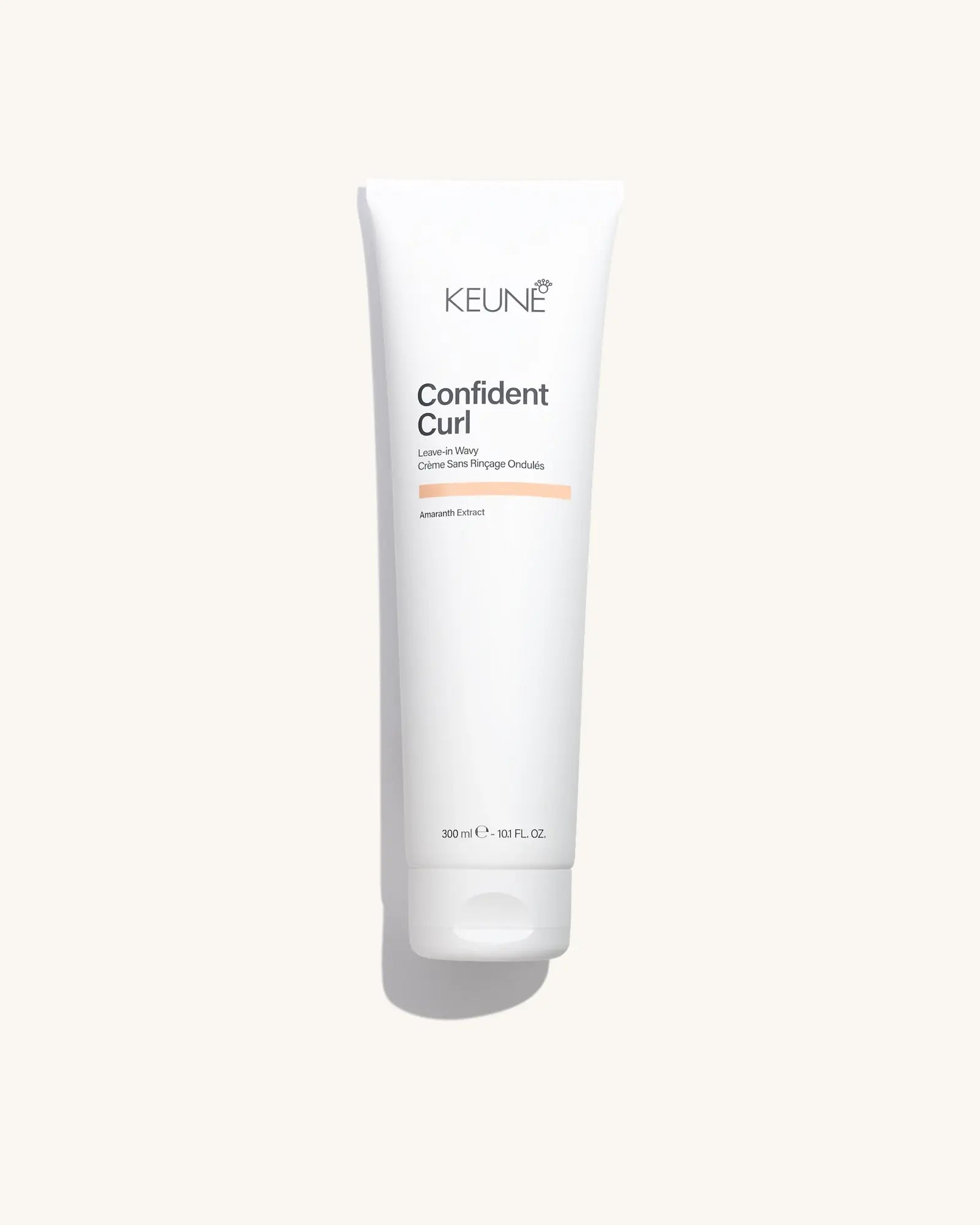 Keune Confident Curl Leave-in Wavy product pack shot on Bijou cream background