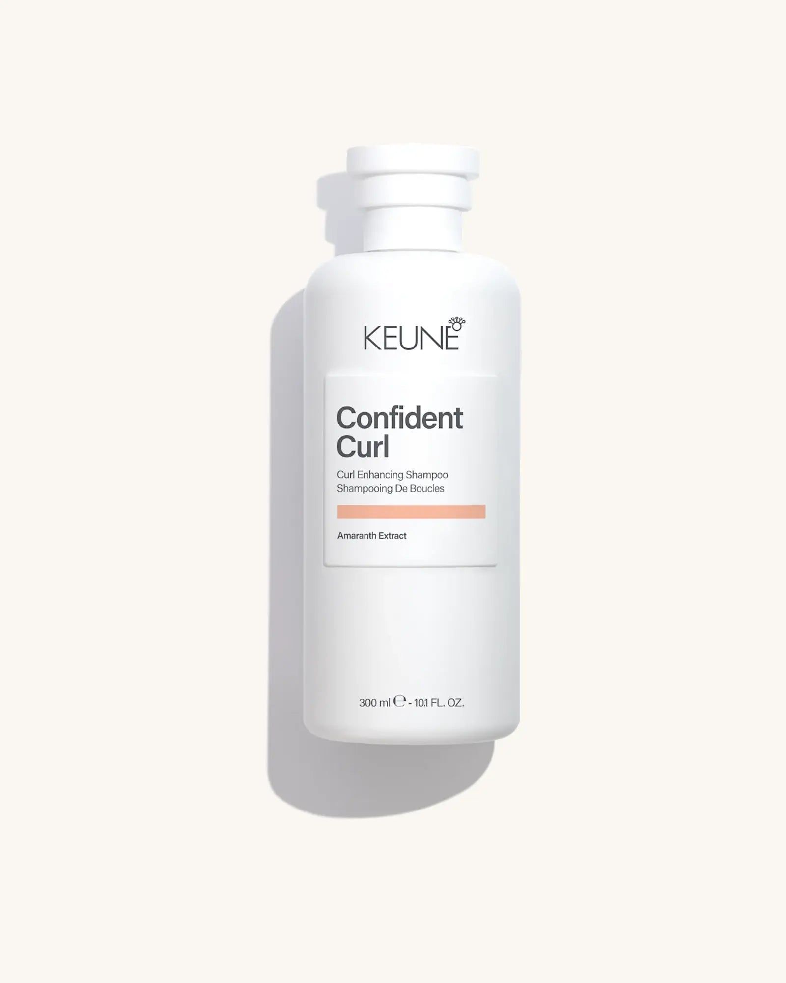Keune Confident Curl Shampoo product pack shot on Bijou cream background