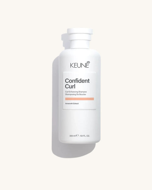 Keune Confident Curl Shampoo product pack shot on Bijou cream background