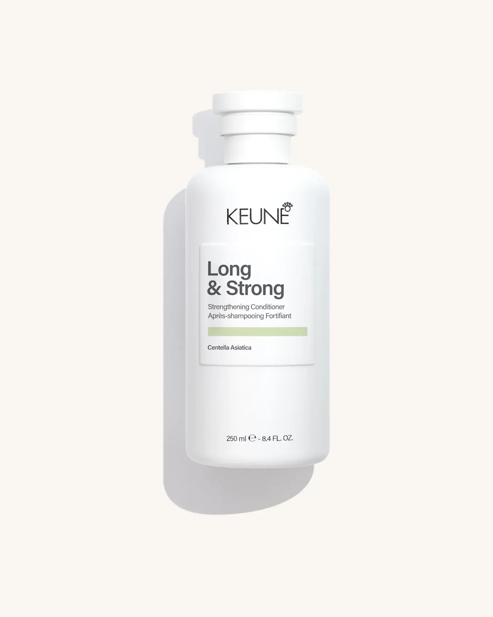 Keune Long & Strong Conditioner product pack shot on Bijou cream background
