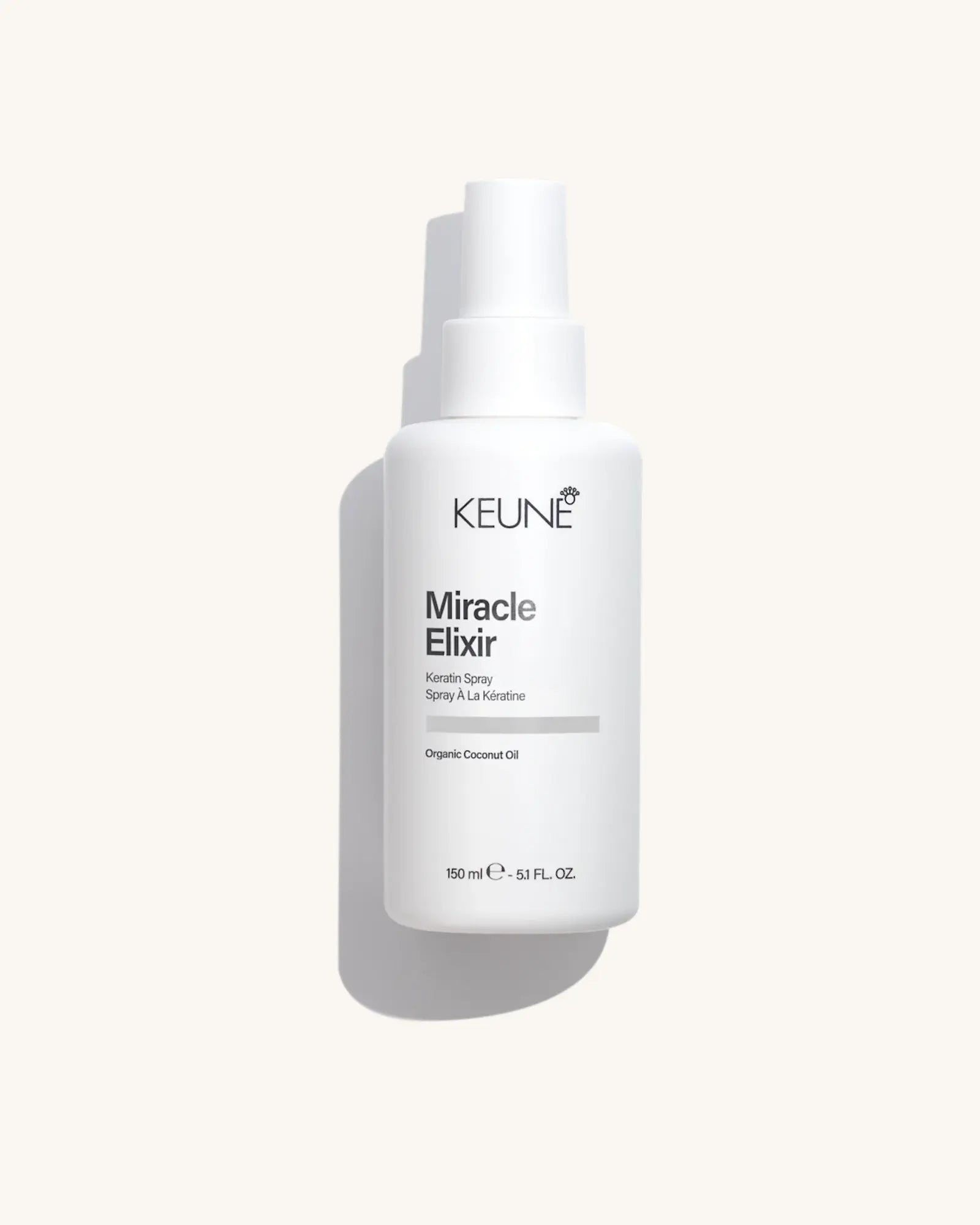 Keune Miracle Elixir Spray product pack shot on Bijou cream background