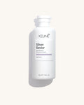 Keune Silver Savior Shampoo product pack shot on Bijou cream background